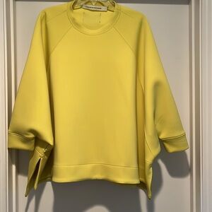 Darling swing top by Cogthebigsmoke.  Bright yellow- feels like neoprene. OS